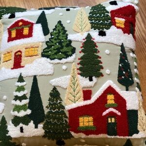 Cozy Holiday Village Pillow with Red and Green Design
